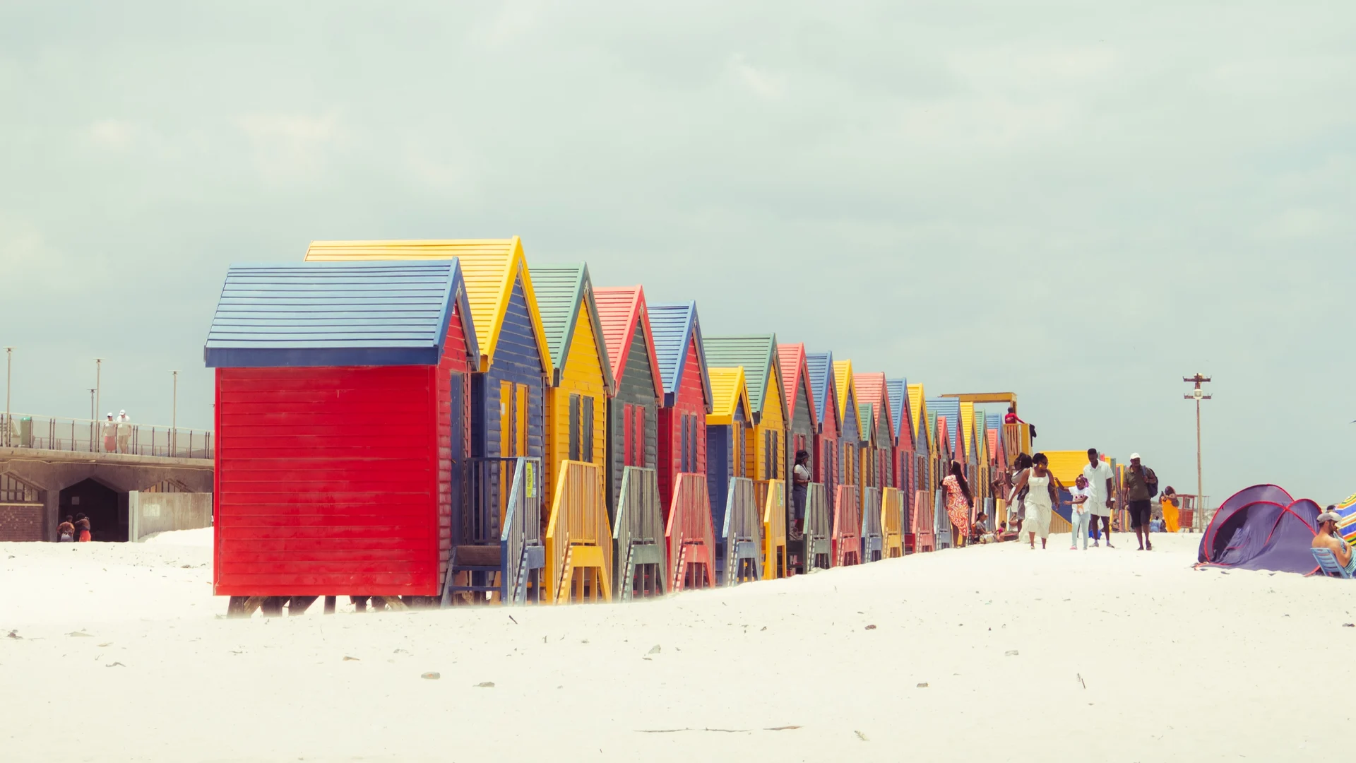 Colourful beach huts beside the sea