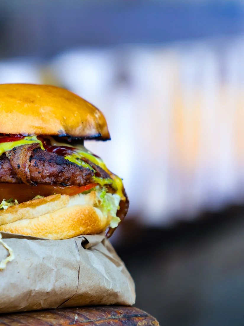 Close-up of a burger and its toppings