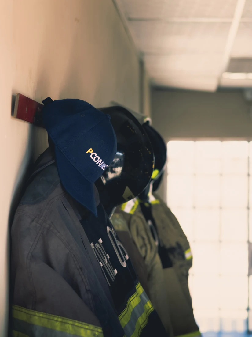 Close-up of PConnect branded workwear and cap