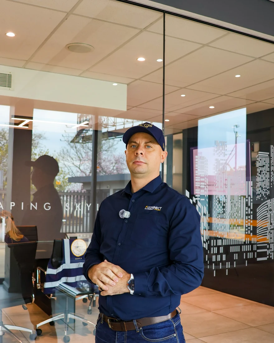 Indoor portrait of a person in a branded shirt