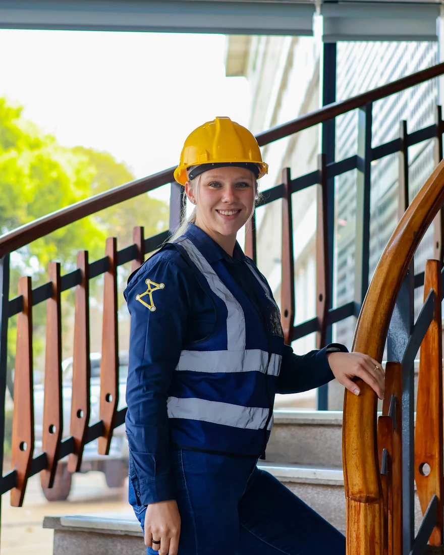 Portrait in safety workwear and a yellow hard hat