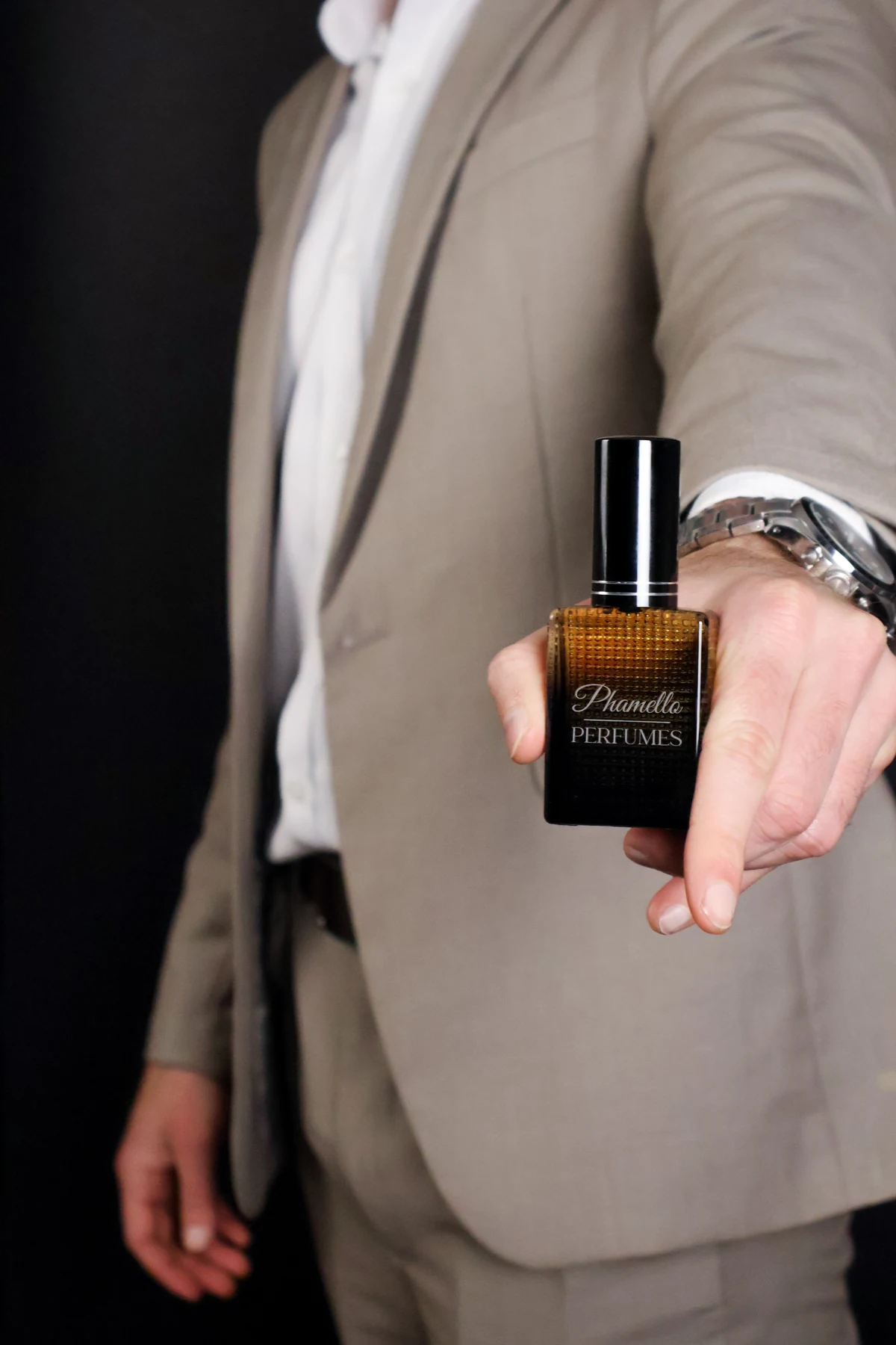 Phamello Perfumes bottle with branded engraving held in a hand